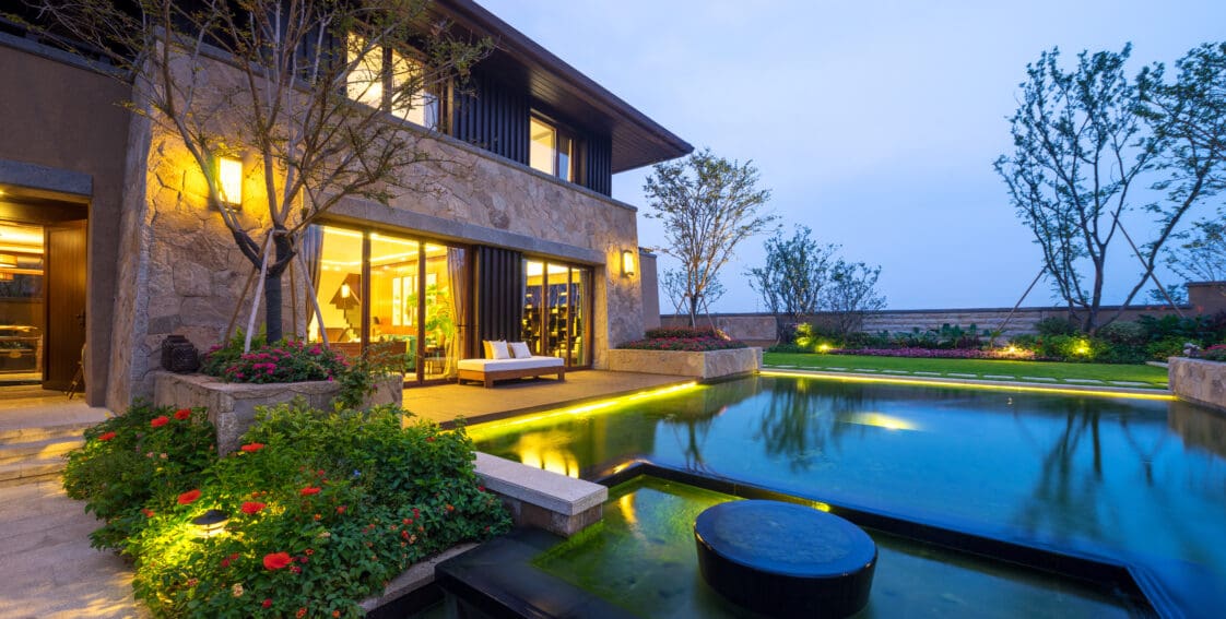exterior of modern building with outdoor landscape lighting