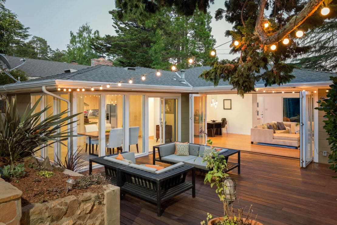 Patio wooden deck at night with overhead lighting