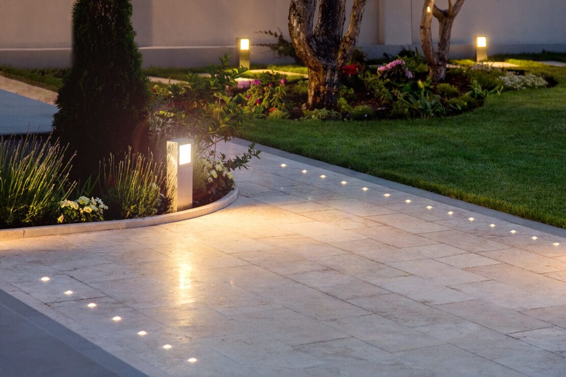 Backyard pathway with professional outdoor lighting